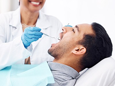 Patient receiving dental cleaning