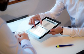 A dentist discussing payment options with a patient