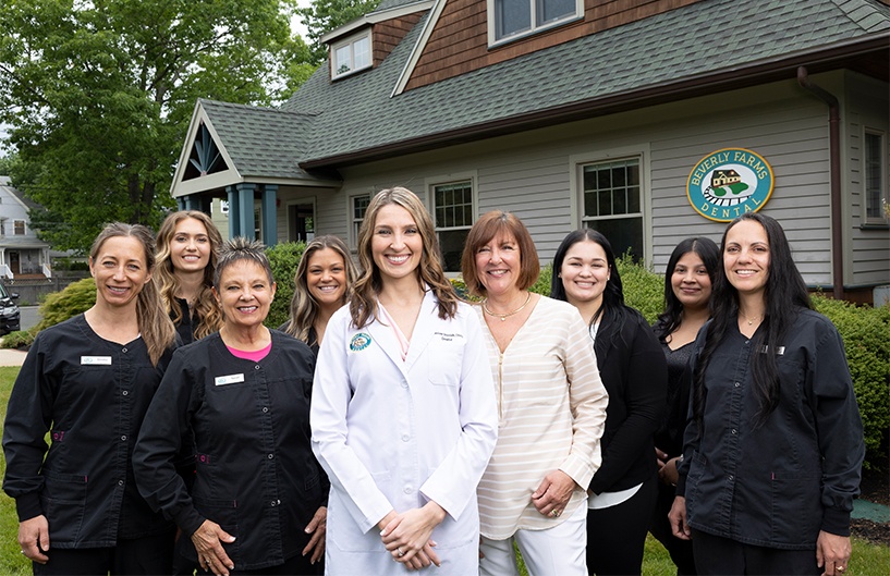 Beverly dentist and dental team members smiling outside of Beverly Farms Dental