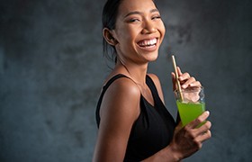 person drinking out of a straw