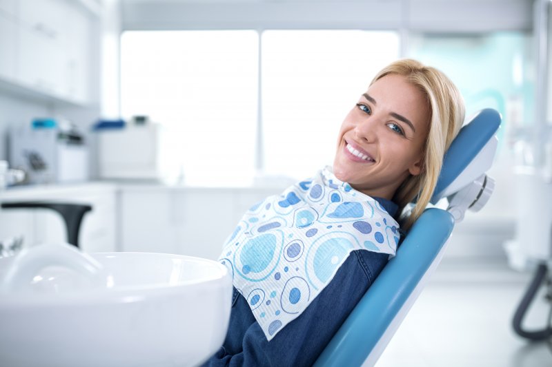 Woman smiling at dentist appointment