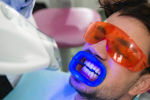 man receiving teeth whitening