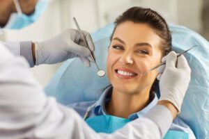 a dentist examining a patient's smile